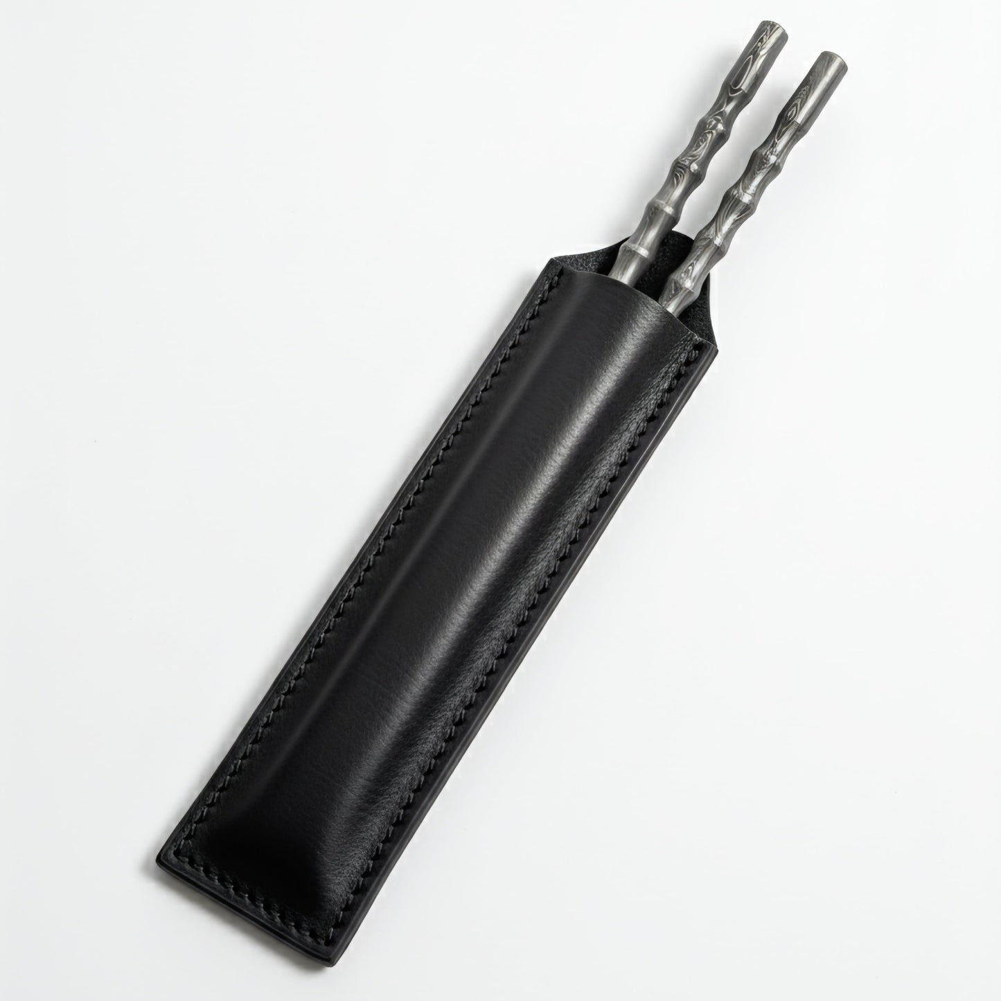 Black leather sheath with two metal tools chopsticks