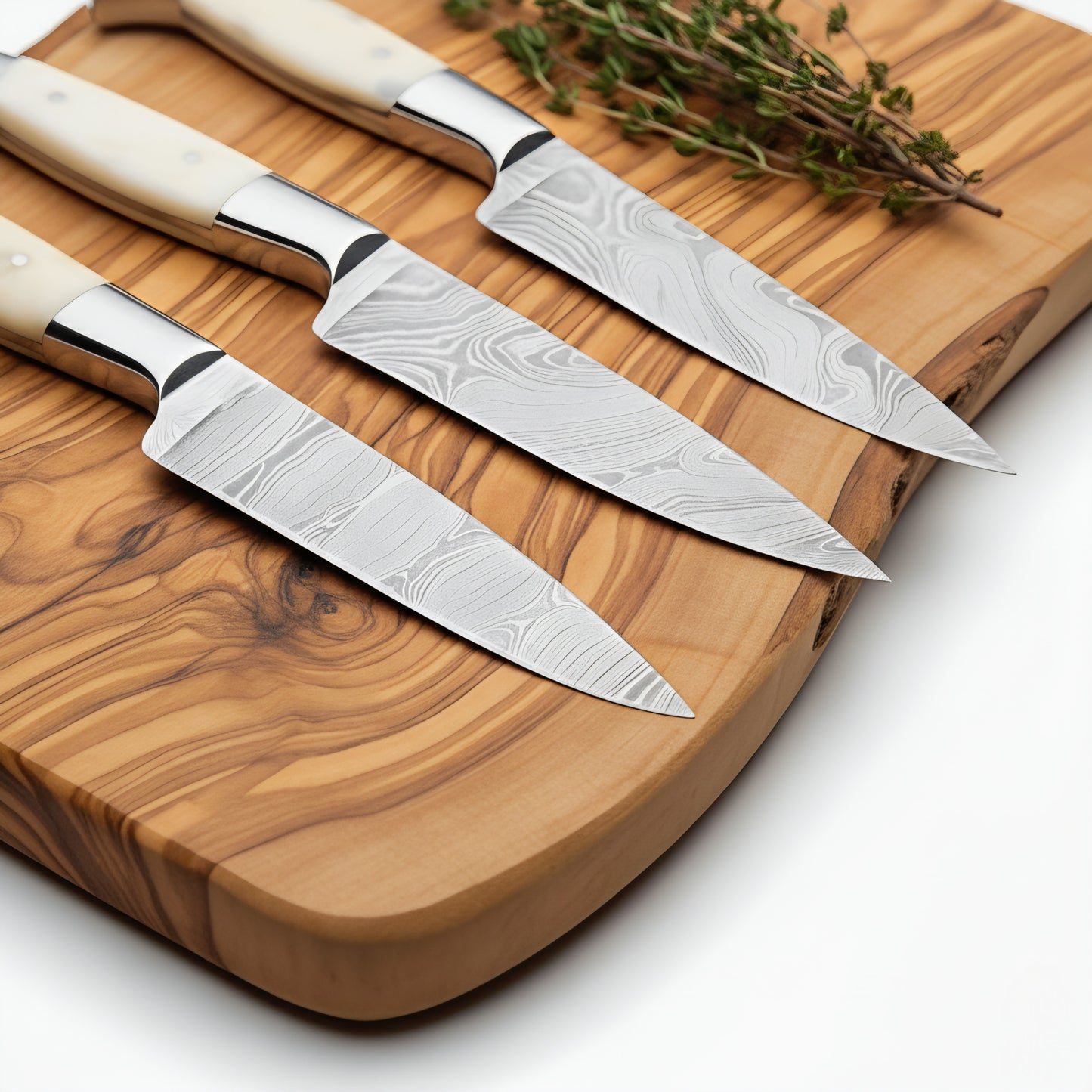 Set of knives with wooden handles on a wooden cutting board