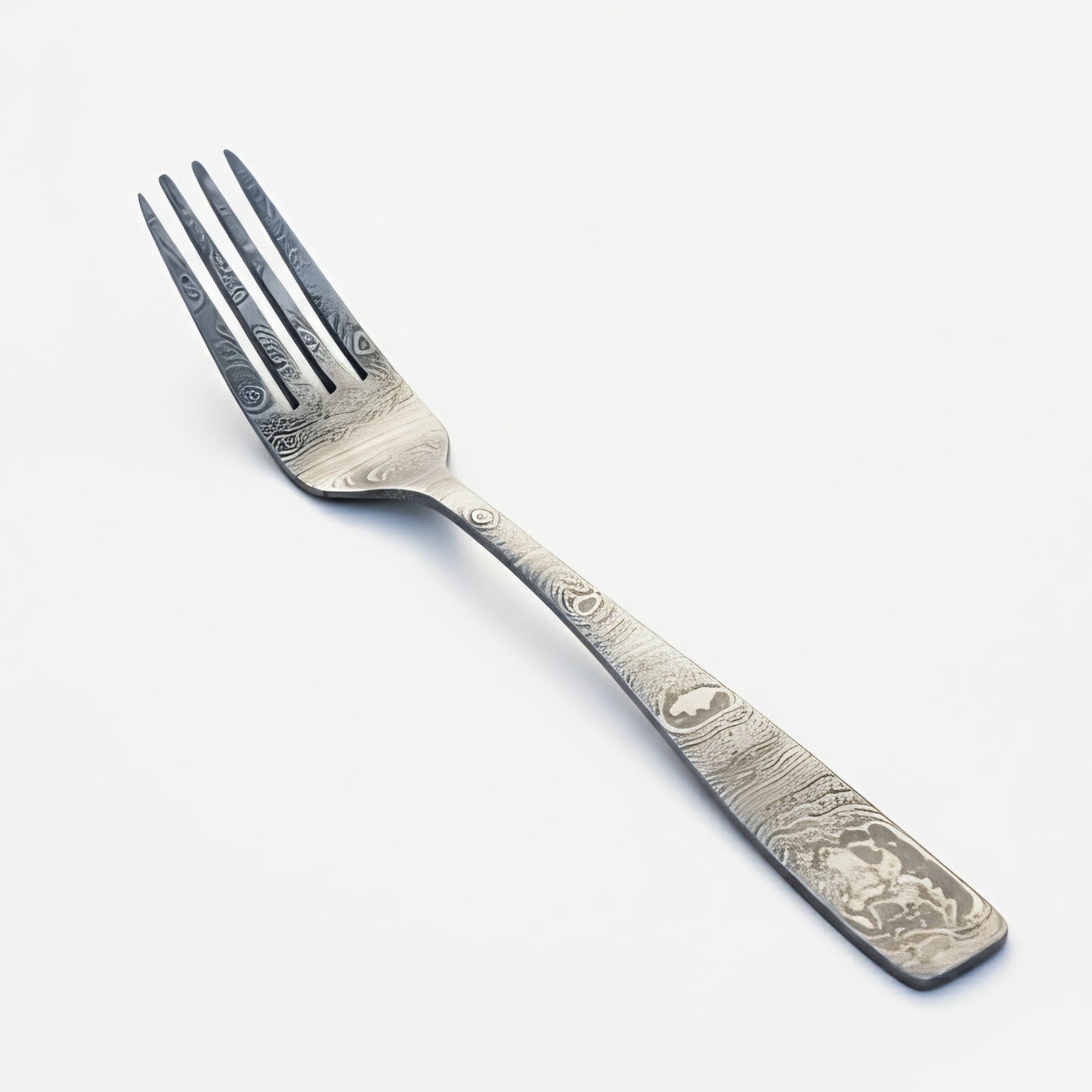 Decorative silver fork on a white background Damascus cutlery set