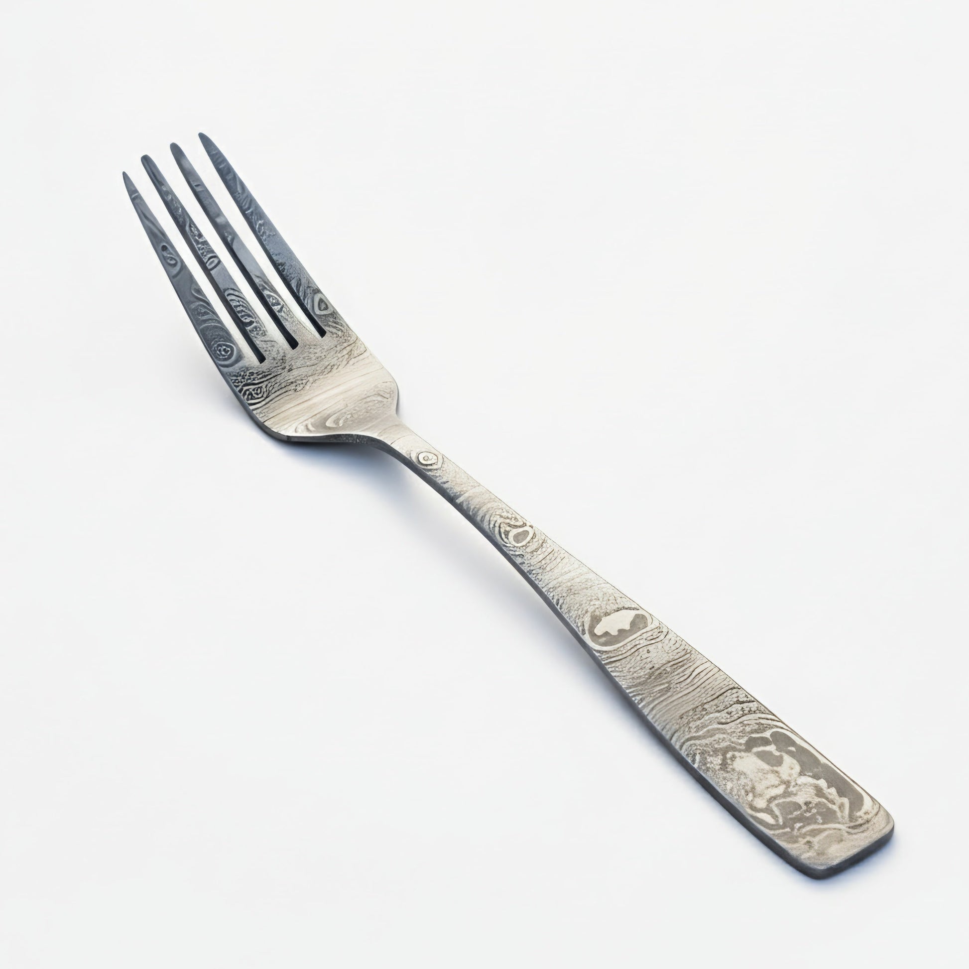 Decorative silver fork on a white background Damascus cutlery set