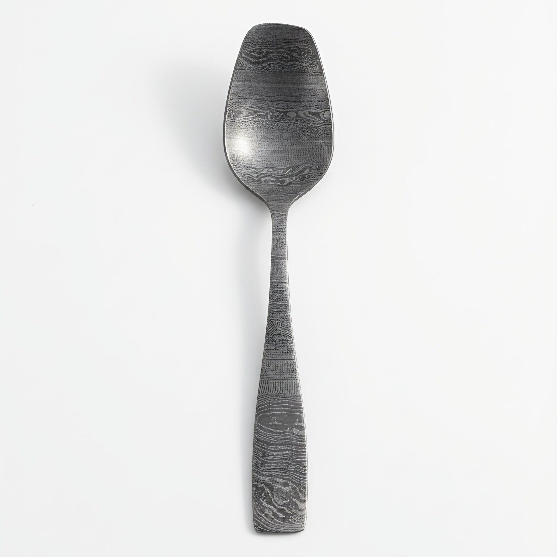 Decorative spoon with textured handle on a white background Damascus cutlery set