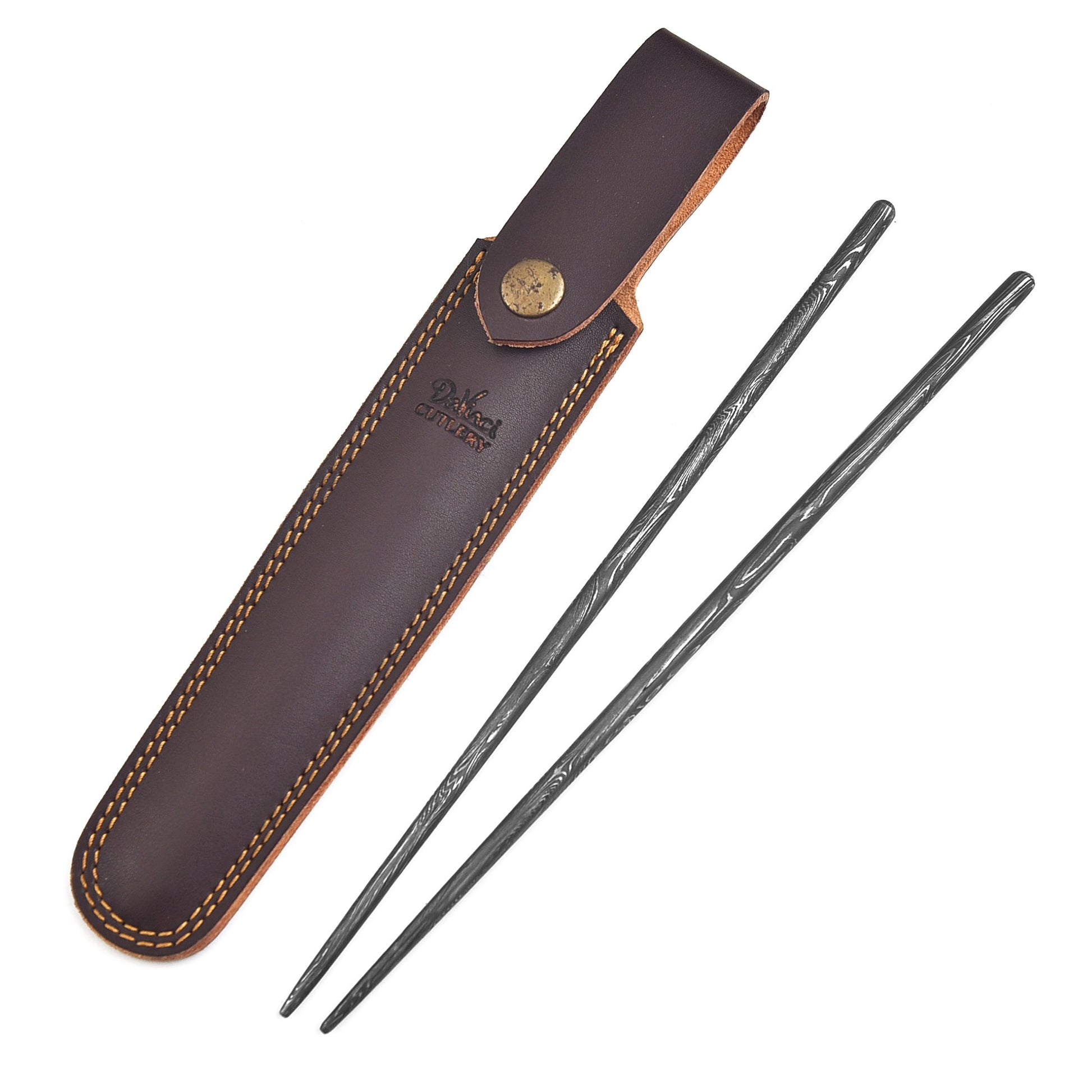 Two black sticks with a brown leather sheath on a white background