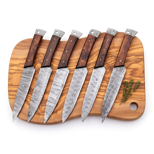 Set of eight knives with wooden handles on a wooden cutting board.