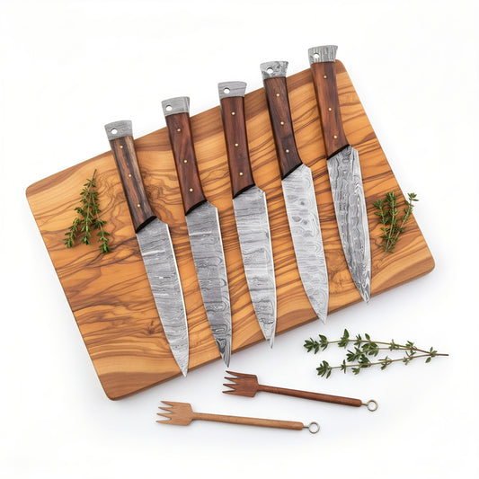 Set of five knives with wooden handles on a wooden cutting board with herbs, on a white background.